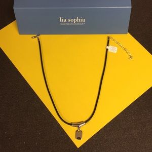 Black cord necklace with silver clasp and charm